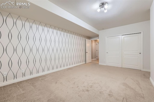 2252 Conservatory Pt, Colorado Springs, CO 80918 - unfurnished bedroom featuring light colored carpet, baseboards, and a closet