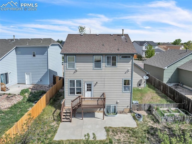 12572 Catch Pen Rd, Peyton, CO 80831 - back of house featuring a patio, a fenced backyard, a deck, and a residential view
