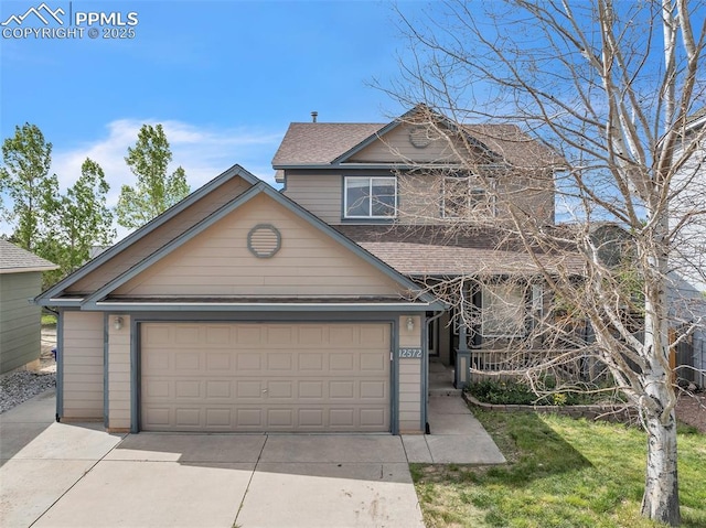 12572 Catch Pen Rd, Peyton, CO 80831 - traditional home featuring roof with shingles and driveway