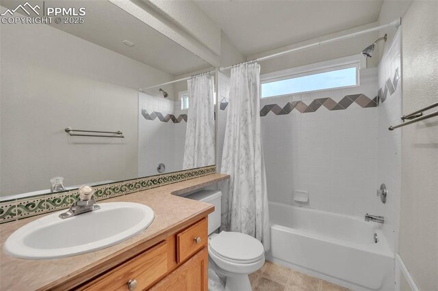 12572 Catch Pen Rd, Peyton, CO 80831 - bathroom with shower / bath combo with shower curtain, vanity, toilet, and tile patterned flooring