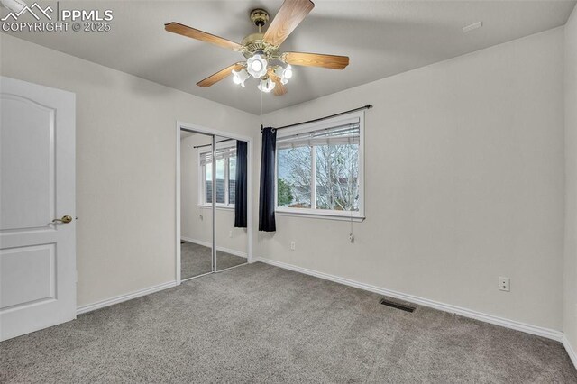12572 Catch Pen Rd, Peyton, CO 80831 - unfurnished bedroom featuring carpet flooring, baseboards, a closet, and a ceiling fan