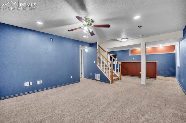 12572 Catch Pen Rd, Peyton, CO 80831 - finished basement with a ceiling fan, carpet, stairway, a textured ceiling, and baseboards