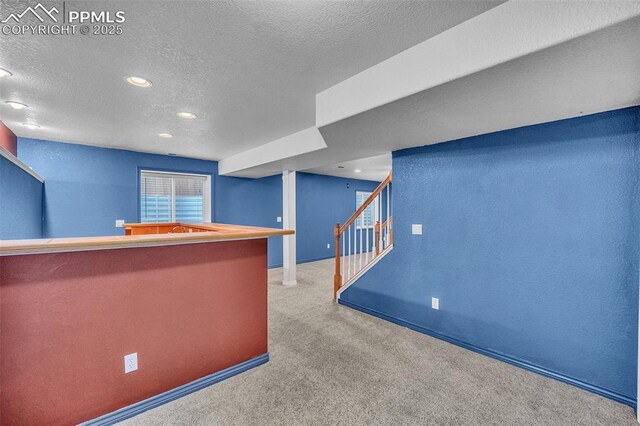 12572 Catch Pen Rd, Peyton, CO 80831 - bar featuring carpet flooring, a textured ceiling, stairs, recessed lighting, and baseboards