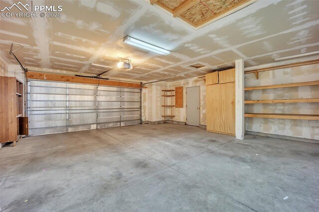 12572 Catch Pen Rd, Peyton, CO 80831 - garage featuring a garage door opener
