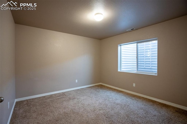 1985 Reed Grass Way, Colorado Springs, CO 80915 - empty room featuring carpet flooring and baseboards