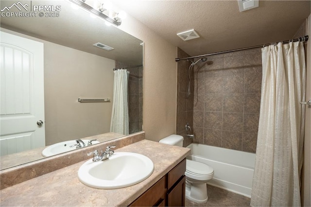 1985 Reed Grass Way, Colorado Springs, CO 80915 - bathroom with vanity, toilet, shower / bathtub combination with curtain, and a textured ceiling