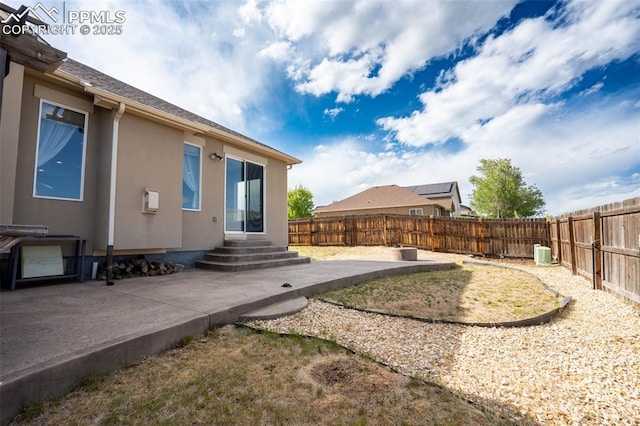 1985 Reed Grass Way, Colorado Springs, CO 80915 - fenced backyard featuring a patio and entry steps