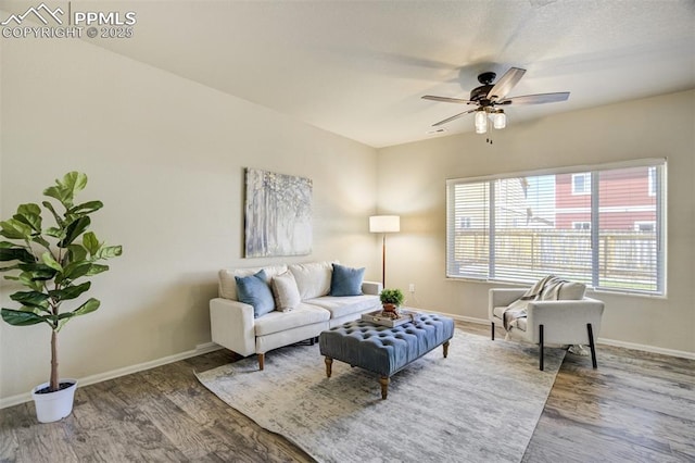 7923 Wagonwood Pl, Colorado Springs, CO 80908 - living area with wood finished floors, baseboards, and a ceiling fan
