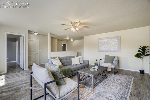 7923 Wagonwood Pl, Colorado Springs, CO 80908 - living area with ceiling fan, wood finished floors, and baseboards