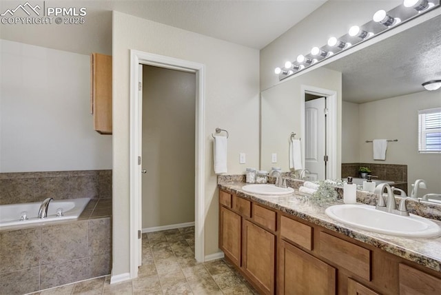 7923 Wagonwood Pl, Colorado Springs, CO 80908 - bathroom featuring double vanity, a garden tub, tile patterned floors, and baseboards