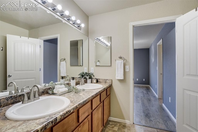 7923 Wagonwood Pl, Colorado Springs, CO 80908 - full bath with double vanity and baseboards