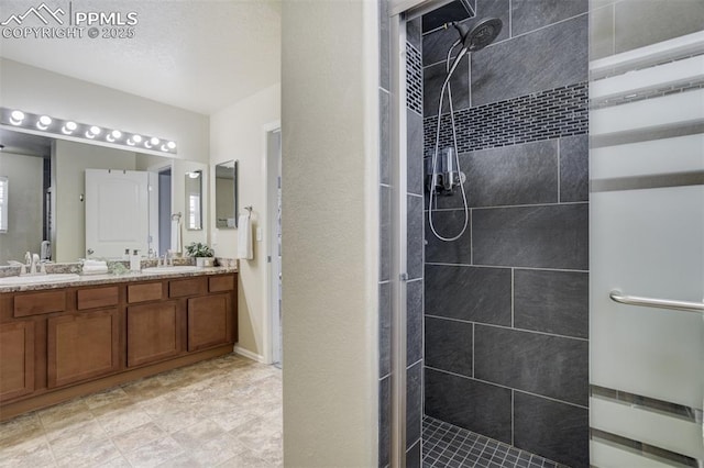 7923 Wagonwood Pl, Colorado Springs, CO 80908 - bathroom featuring a tile shower and double vanity