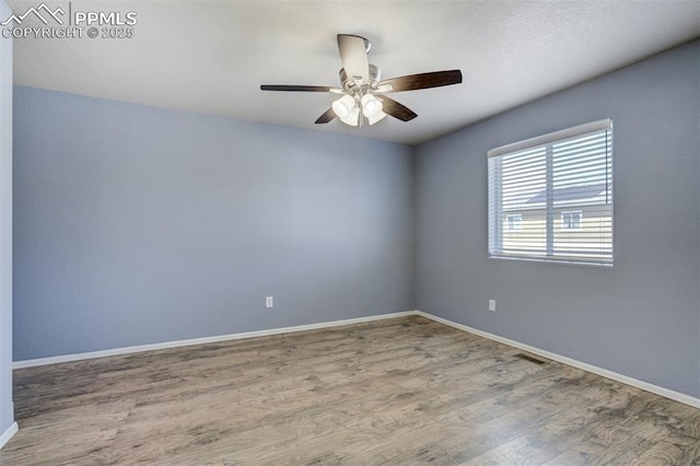 7923 Wagonwood Pl, Colorado Springs, CO 80908 - empty room featuring baseboards, wood finished floors, and ceiling fan