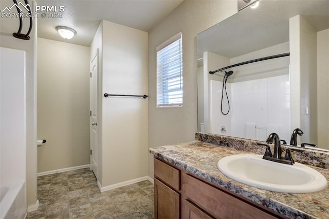 7923 Wagonwood Pl, Colorado Springs, CO 80908 - full bathroom featuring vanity and baseboards