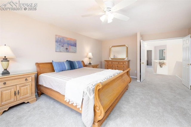 2261 Palm Dr Unit C, Colorado Springs, CO 80918 - bedroom with light colored carpet, a ceiling fan, and baseboards