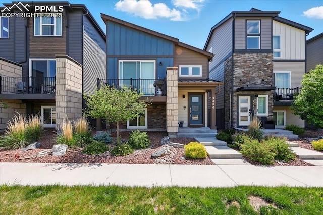 2454 Jazzy Lady Ct, Colorado Springs, CO 80922 - view of front of home with board and batten siding and stone siding