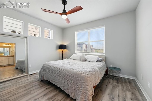 2454 Jazzy Lady Ct, Colorado Springs, CO 80922 - bedroom with wood finished floors, baseboards, and a ceiling fan