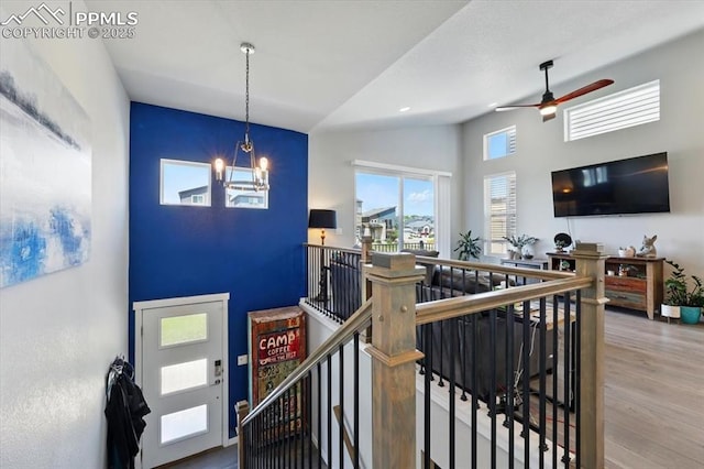 2454 Jazzy Lady Ct, Colorado Springs, CO 80922 - entryway with ceiling fan, wood finished floors, high vaulted ceiling, and a chandelier