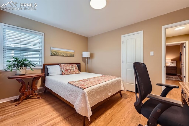 1609 Palmer Park Blvd, Colorado Springs, CO 80909 - bedroom featuring light wood-style flooring and baseboards