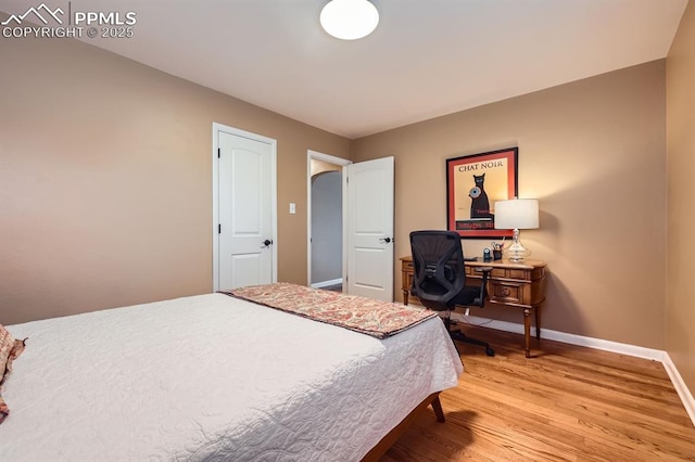 1609 Palmer Park Blvd, Colorado Springs, CO 80909 - bedroom featuring light wood-type flooring and baseboards
