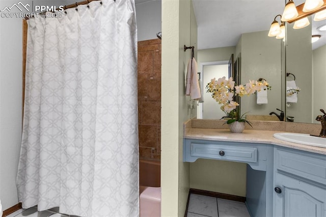 490 Wintery Cir, Colorado Springs, CO 80919 - full bathroom featuring shower / bath combo with shower curtain, vanity, tile patterned flooring, and baseboards