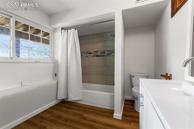 490 Wintery Cir, Colorado Springs, CO 80919 - full bathroom featuring shower / tub combo, toilet, wood finished floors, vanity, and baseboards