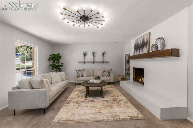 490 Wintery Cir, Colorado Springs, CO 80919 - living room featuring carpet floors, a chandelier, a fireplace, and baseboards