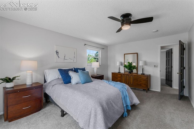 490 Wintery Cir, Colorado Springs, CO 80919 - carpeted bedroom featuring a textured ceiling, a ceiling fan, and baseboards