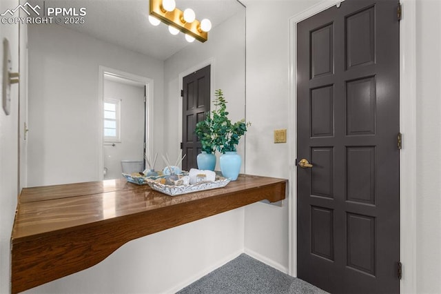 490 Wintery Cir, Colorado Springs, CO 80919 - carpeted entryway with baseboards