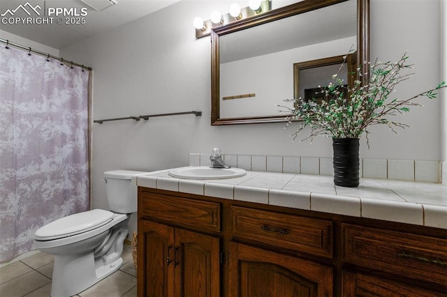 490 Wintery Cir, Colorado Springs, CO 80919 - bathroom with vanity, toilet, tile patterned floors, and a shower with curtain