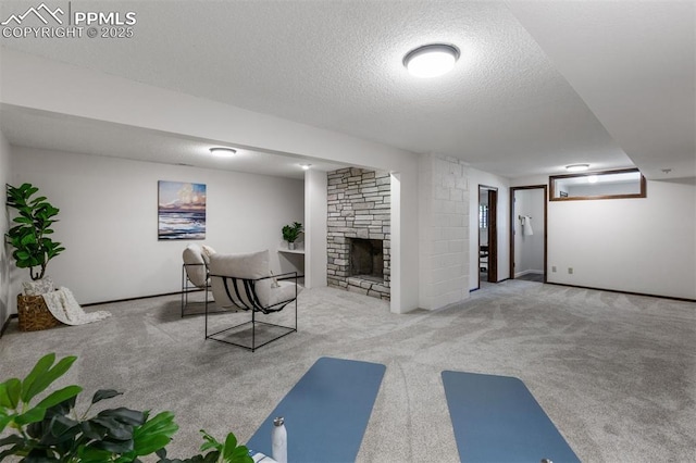 490 Wintery Cir, Colorado Springs, CO 80919 - carpeted office space featuring a textured ceiling and a stone fireplace