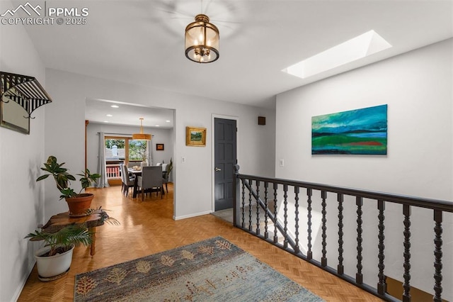 490 Wintery Cir, Colorado Springs, CO 80919 - corridor featuring a skylight, baseboards, and recessed lighting