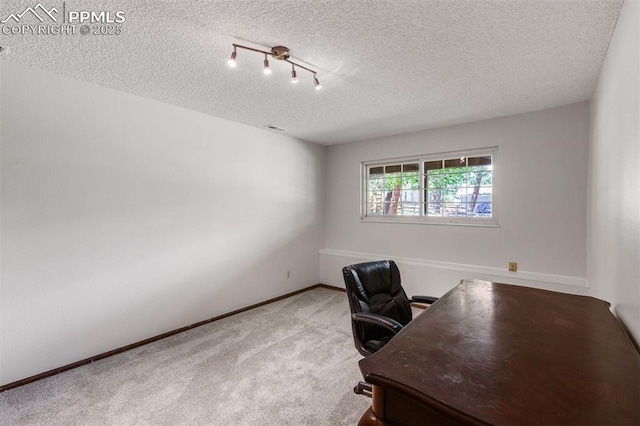 490 Wintery Cir, Colorado Springs, CO 80919 - carpeted home office featuring a textured ceiling and baseboards