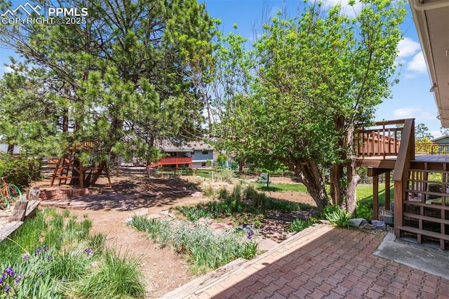 490 Wintery Cir, Colorado Springs, CO 80919 - view of yard featuring a deck and a patio
