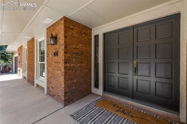 490 Wintery Cir, Colorado Springs, CO 80919 - entrance to property with brick siding and covered porch