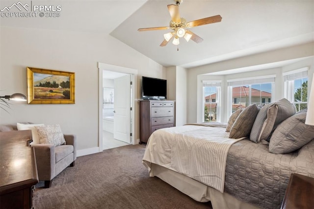 9969 Bridgeport Dr, Colorado Springs, CO 80920 - carpeted bedroom featuring vaulted ceiling, baseboards, connected bathroom, and a ceiling fan