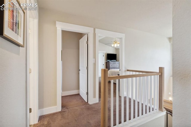9969 Bridgeport Dr, Colorado Springs, CO 80920 - corridor featuring carpet flooring, an upstairs landing, and baseboards