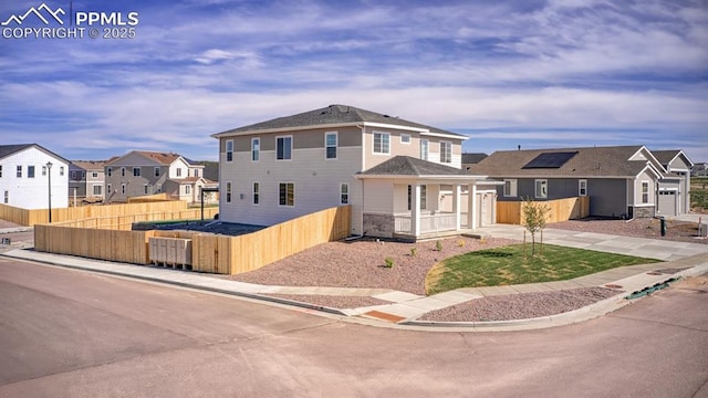 10046 Keating Dr, Peyton, CO 80831 - view of front facade with covered porch, a residential view, concrete driveway, and a garage