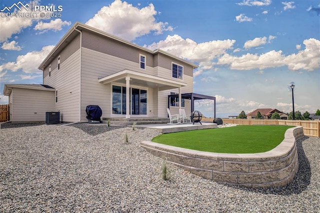 10046 Keating Dr, Peyton, CO 80831 - rear view of property with a patio area and central AC