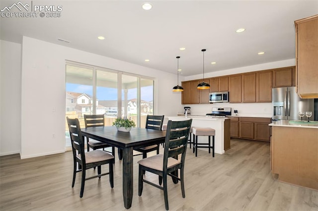 10046 Keating Dr, Peyton, CO 80831 - dining room featuring light wood-type flooring, recessed lighting, and baseboards