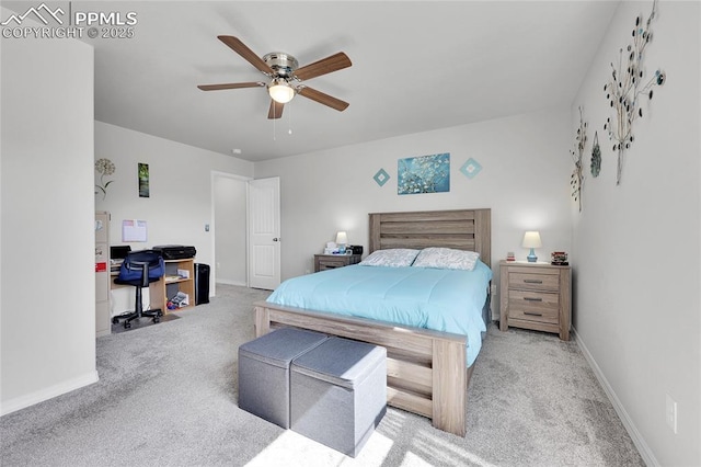 bedroom with carpet, a desk, baseboards, and ceiling fan