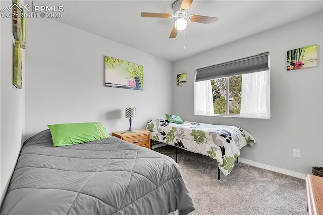 bedroom with carpet floors, baseboards, and a ceiling fan