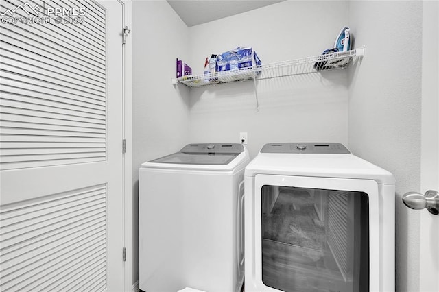 laundry area with separate washer and dryer