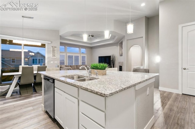 5799 Adkisson Pl, Colorado Springs, CO 80924 - kitchen with a sink, dishwasher, open floor plan, a ceiling fan, and light wood-style floors