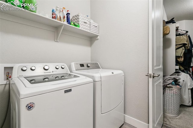 5799 Adkisson Pl, Colorado Springs, CO 80924 - laundry room with independent washer and dryer, baseboards, and light colored carpet