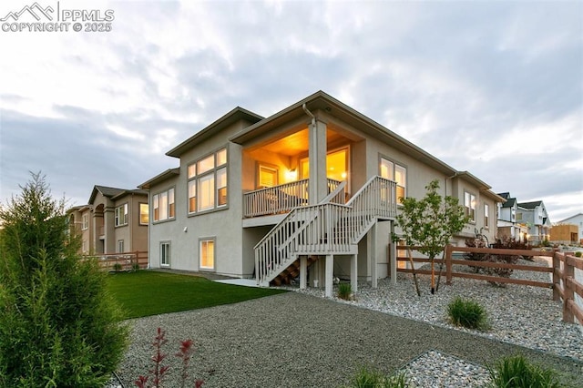 5799 Adkisson Pl, Colorado Springs, CO 80924 - rear view of house with stairway, stucco siding, and a residential view
