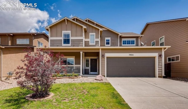 7866 Stockton Dr, Fountain, CO 80817 - view of front of property with board and batten siding, a porch, driveway, and a front lawn