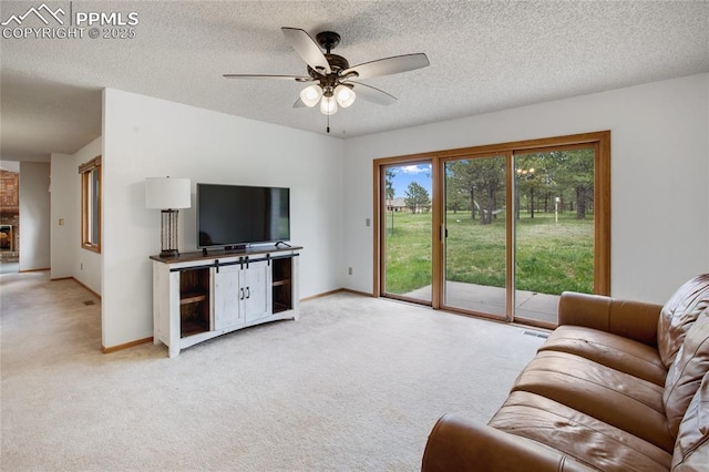 390 E Stirrup Trl, Monument, CO 80132 - living area with light colored carpet, a ceiling fan, baseboards, and a textured ceiling