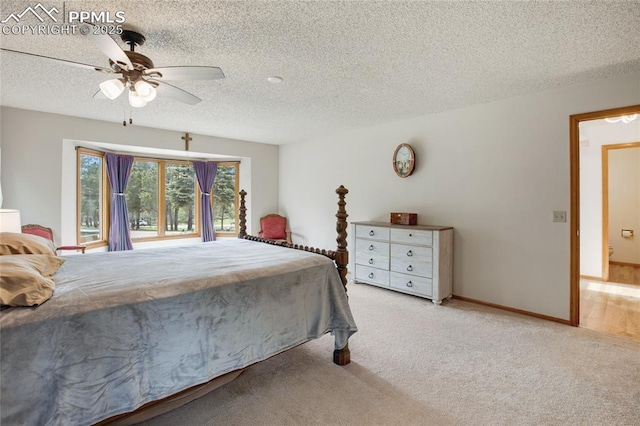 390 E Stirrup Trl, Monument, CO 80132 - bedroom featuring a textured ceiling, carpet, ceiling fan, and baseboards