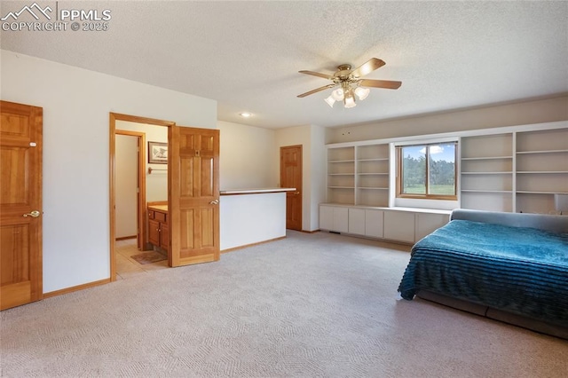 390 E Stirrup Trl, Monument, CO 80132 - bedroom featuring light colored carpet, a textured ceiling, baseboards, and a ceiling fan